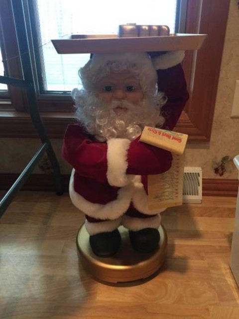 21 Miscellaneous Remote controlled serving Santa 22 inches tall.
