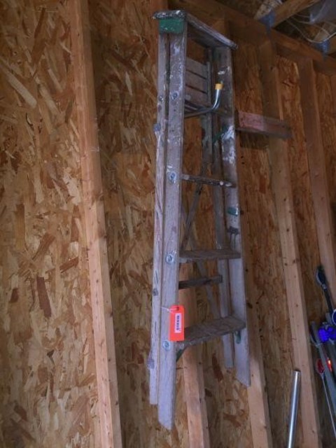 215 Miscellaneous 5 foot wood step ladder.